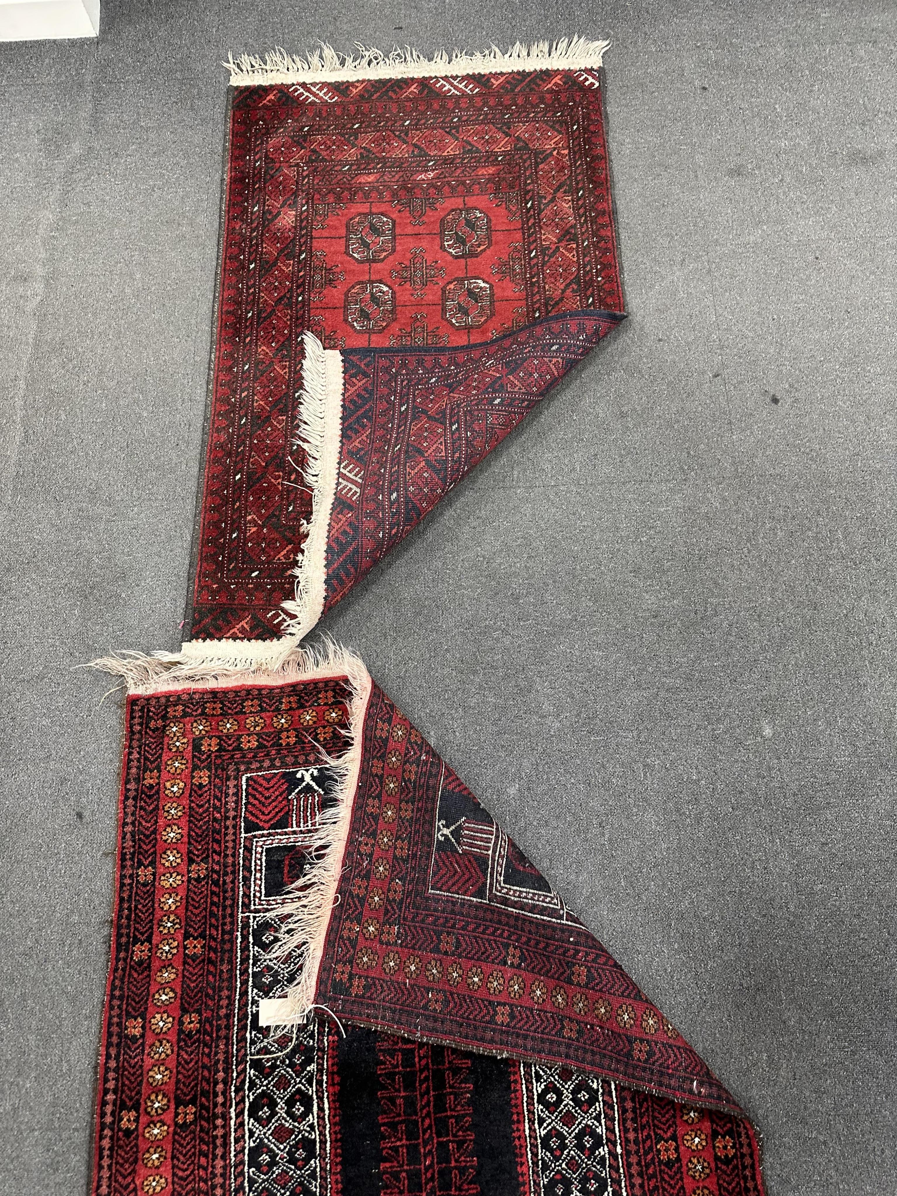 A Belouch prayer rug and Bokhara rug, larger 140cm x 95cm. Condition - fair.